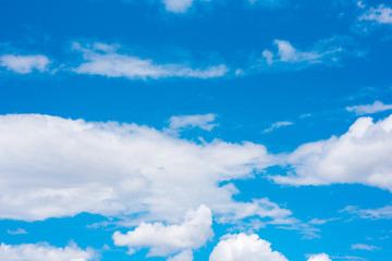 Obraz na płótnie Canvas Beautiful white cumulonimbus clouds against the background of the bright blue sky