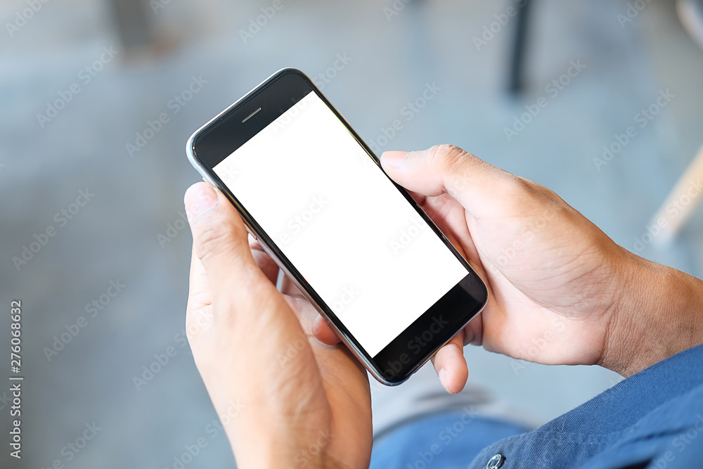 Poster cropped shot view of man hands holding smart phone with blank copy space screen for your text messag