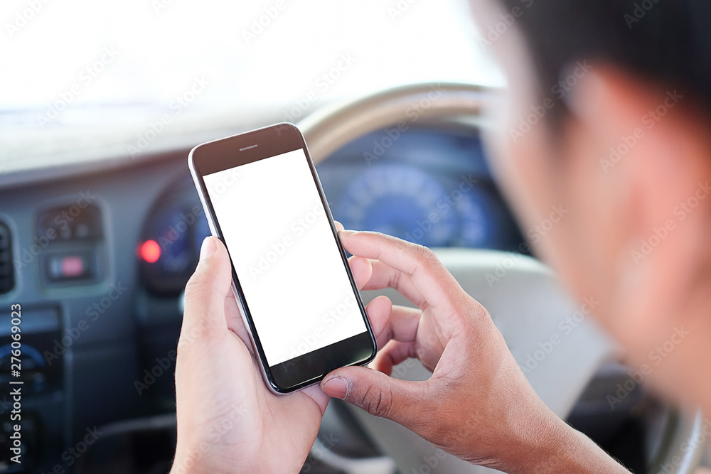 Poster cropped shot view the driver uses the phone while driving. modern smart phone with round edges. isol