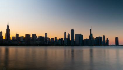 Naklejka na ściany i meble Silhouette of Chicago skyline in the evening - CHICAGO, ILLINOIS - JUNE 12, 2019