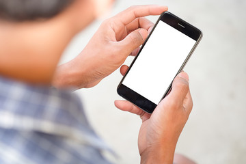 Cropped shot view of man hands holding smart phone with blank copy space screen for your text message or information content, female reading text message on cell telephone during in urban setting. 