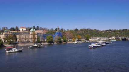 Aerial view of the vessel sailing on the water channel of Prague. Czech