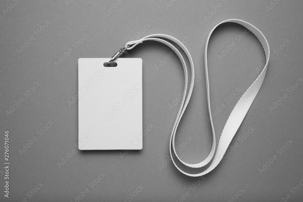 Poster empty layout layout. common blank label name tag hanging on neck with thread.