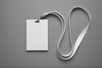 Empty layout layout. Common blank label name tag hanging on neck with thread.