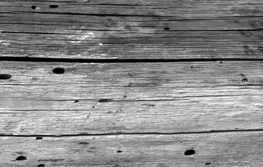 Old grunge wooden fence pattern in black and white.