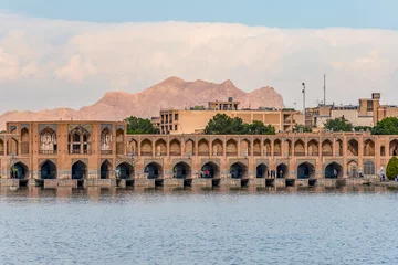 Photo sur Plexiglas Pont Khadjou typical view on Khaju Bridge over Zayandeh river ib Isfahan at the daylight with cloudy sky