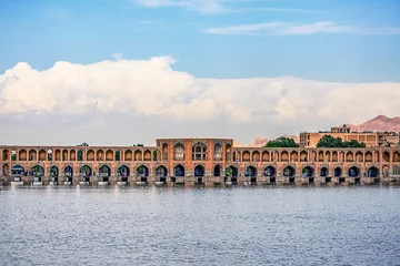 Photo sur Plexiglas Pont Khadjou typical view on Khaju Bridge over Zayandeh river ib Isfahan at the daylight with cloudy sky