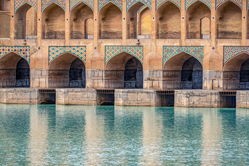 mosaic elements of Khaju Bridge with plenty of arches over Zayandeh river, iranian pattern, Serving as a dam as well