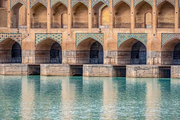 Foto auf Acrylglas Khaju-Brücke mosaic elements of Khaju Bridge with plenty of arches over Zayandeh river, iranian pattern, Serving as a dam as well