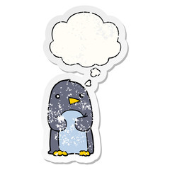 cartoon penguin and thought bubble as a distressed worn sticker