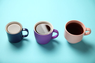 Black tea (coffee) in bright cups, office break, team building.