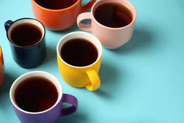 Black tea (coffee) in bright cups, office break, team building.