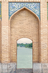 mosaic elements on arch of Khaju Bridge with plenty Zayandeh river, iranian pattern