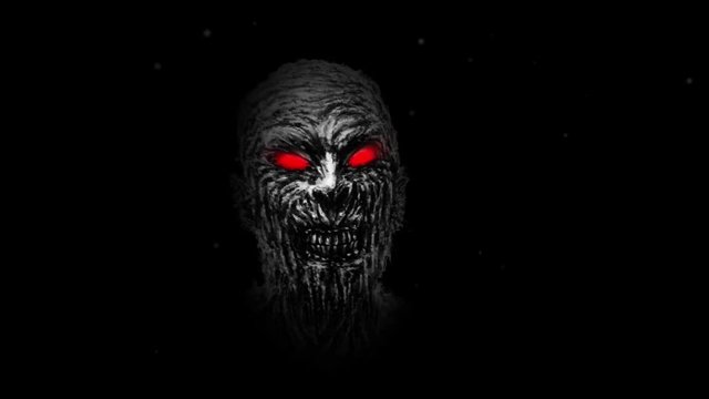 Wounded zombie face with red eyes on black background. Animation in genre of horror. Scary monster character face. 