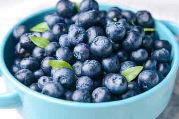 Tasty ripe blueberry in pot, closeup