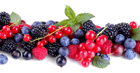 Tasty berries, currants, blackberries, blueberries, raspberries on a white isolated background