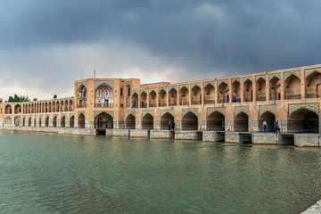 22/05/2019 Isfahan, Iran, typical view on Khaju Bridge over Zayandeh river ib Isfahan at the daylight with cloudy sky