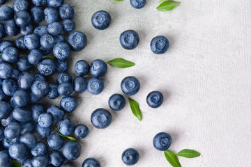 Many ripe blueberry on light background