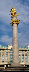 Fototapeta na wymiar Freedom Monument depicting St. George slaying the dragon, sculpted in granite and gold, Tbilisi, Georgia.