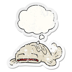 cartoon sad old fish and thought bubble as a distressed worn sticker