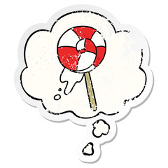 cartoon lollipop and thought bubble as a distressed worn sticker