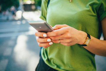 Close-up young woman using mobile phone