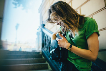 Busy young woman in city