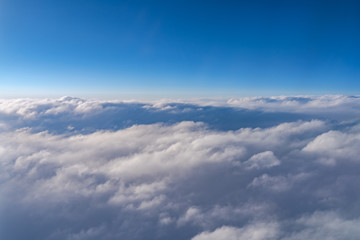 Fototapeta na wymiar View of dark blue sky horizon, up in the air. viewed from an airplane window
