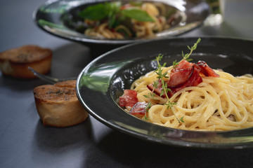 Italian pasta spaghetti dish. Stir-fried spaghetti with chicken, bacon and mushroom.
