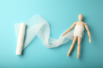 Figure of man with wound of trunk or abdomen, gauze bandage. First aid, injury treatment. Patient in hospital.