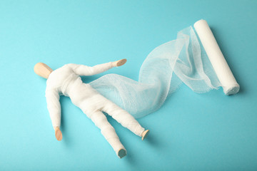 Figure of man with wounds and injuries, gauze bandage. First aid. Emergency fracture, accident.