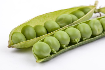 fresh pea pods isolated on white background.