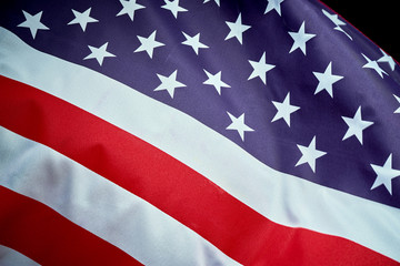 US flag waving in wind on Independence Day in America