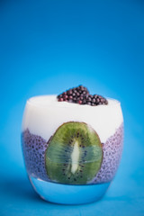 black chia pudding with blackberry and kiwi