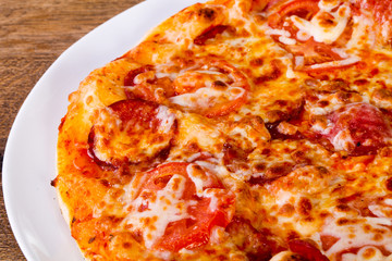 Pepperoni pizza with sausages