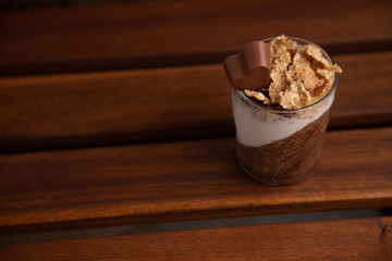 Delicious breakfast, cocoa chia pudding with yogurt and cereals