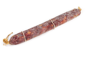 Top view of whole salami on a white background