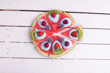 Fototapeta na wymiar vegetarian pizza of watermelon and other fruits