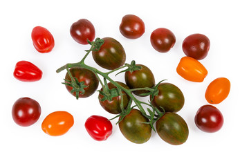 Cluster of cherry tomatoes kumato among other varicolored cherry tomatoes