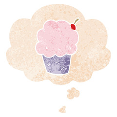 cartoon cupcake and thought bubble in retro textured style