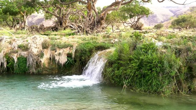 Blue water waterfalls up in the mountains of Salalah, Oman in May.