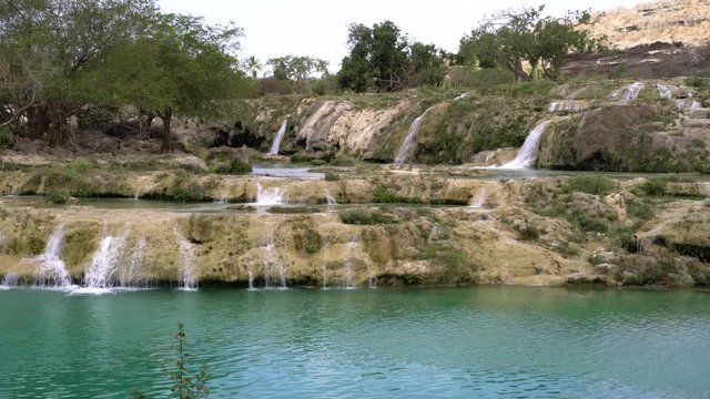 Blue water waterfalls up in the mountains of Salalah, Oman in May.