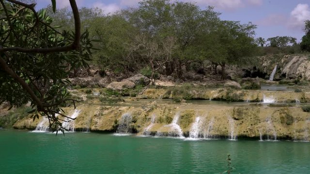 Blue water waterfalls up in the mountains of Salalah, Oman in May.