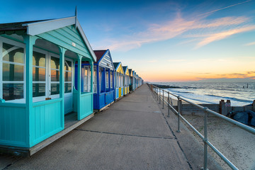 A row of colorful beach huts at Southwold