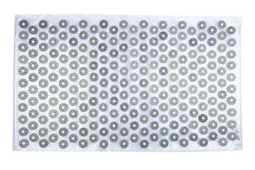 Acupuncture orthopedic massage mat with needles and spikes for feet and body isolated on white...