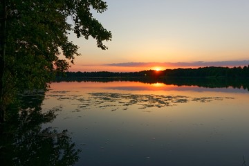 Fototapeta na wymiar View on a lake during sunset