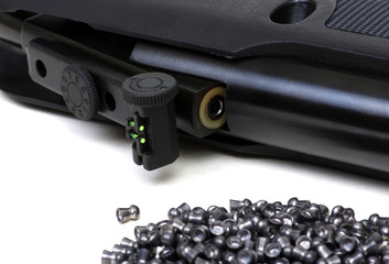 Black air rifle gun on a white