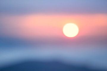 Misty clouds in the mountains at sunrise