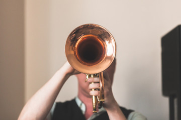 Trumpeter with a trumpet in hands - obrazy, fototapety, plakaty