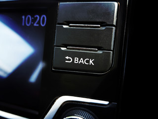 Back button on the head unit multimedia player in the car.